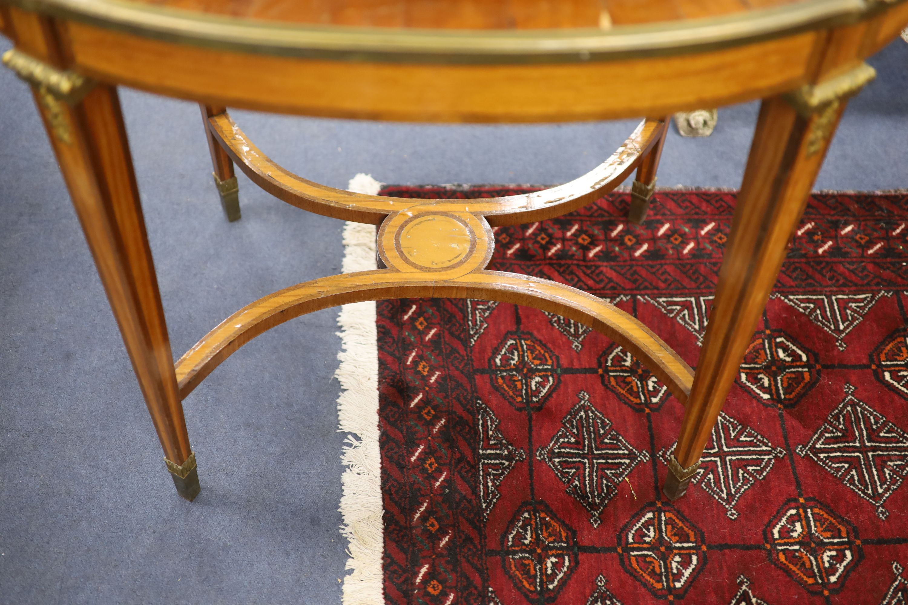 A late 19th century French satinwood, rosewood crossbanded and gilt metal mounted two tier oval etagere,